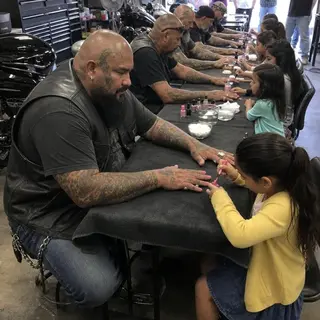 Neighbors Feared the Tattooed Men Gathering Around Little Girls Inside a Locked Garage—Until They Saw What the Bikers Were Holding